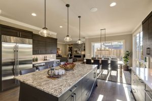 Kitchen with granite countertops and dark wood cabinets