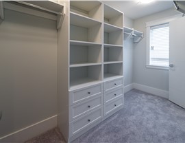 Showcase of blank white color closet with window