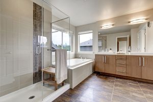 Refaced cabinets in modern master bathroom
