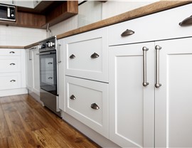 Close-up view of white kitchen cabinets
