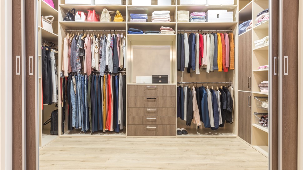 Walk-in closet organization system made from light wood