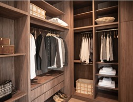 Closet organization system made of medium-toned wood
