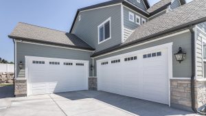 Exterior view of a luxury home with a three-car garage